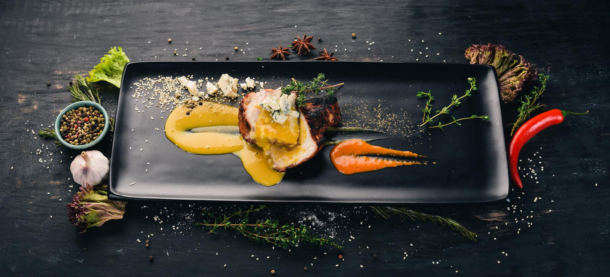 Close-up of plated modern dish on slate